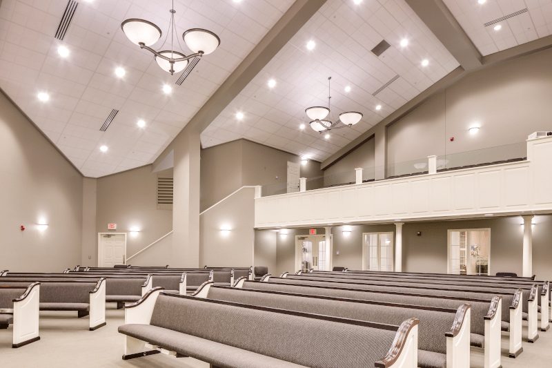 image of inside of a church with white pews