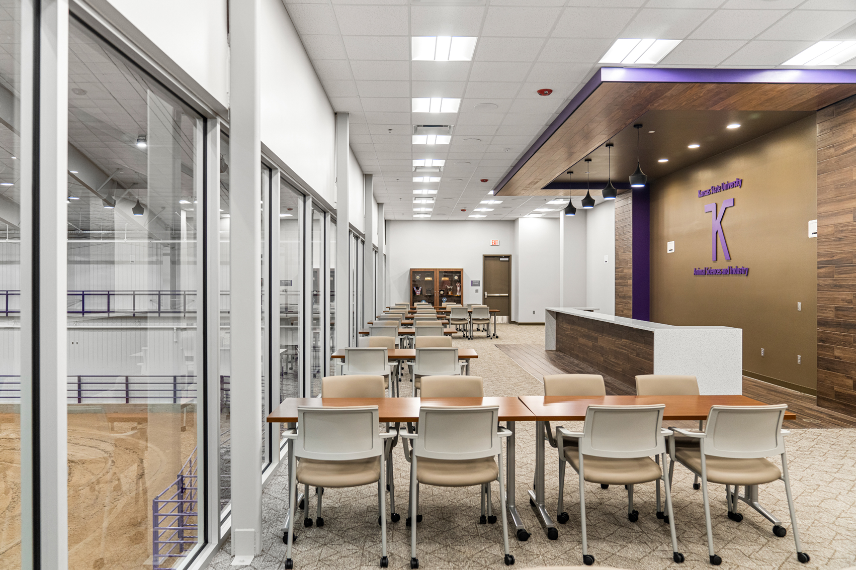 Bilbrey Family Event Center hospitality suite glass wall overlooking the arena