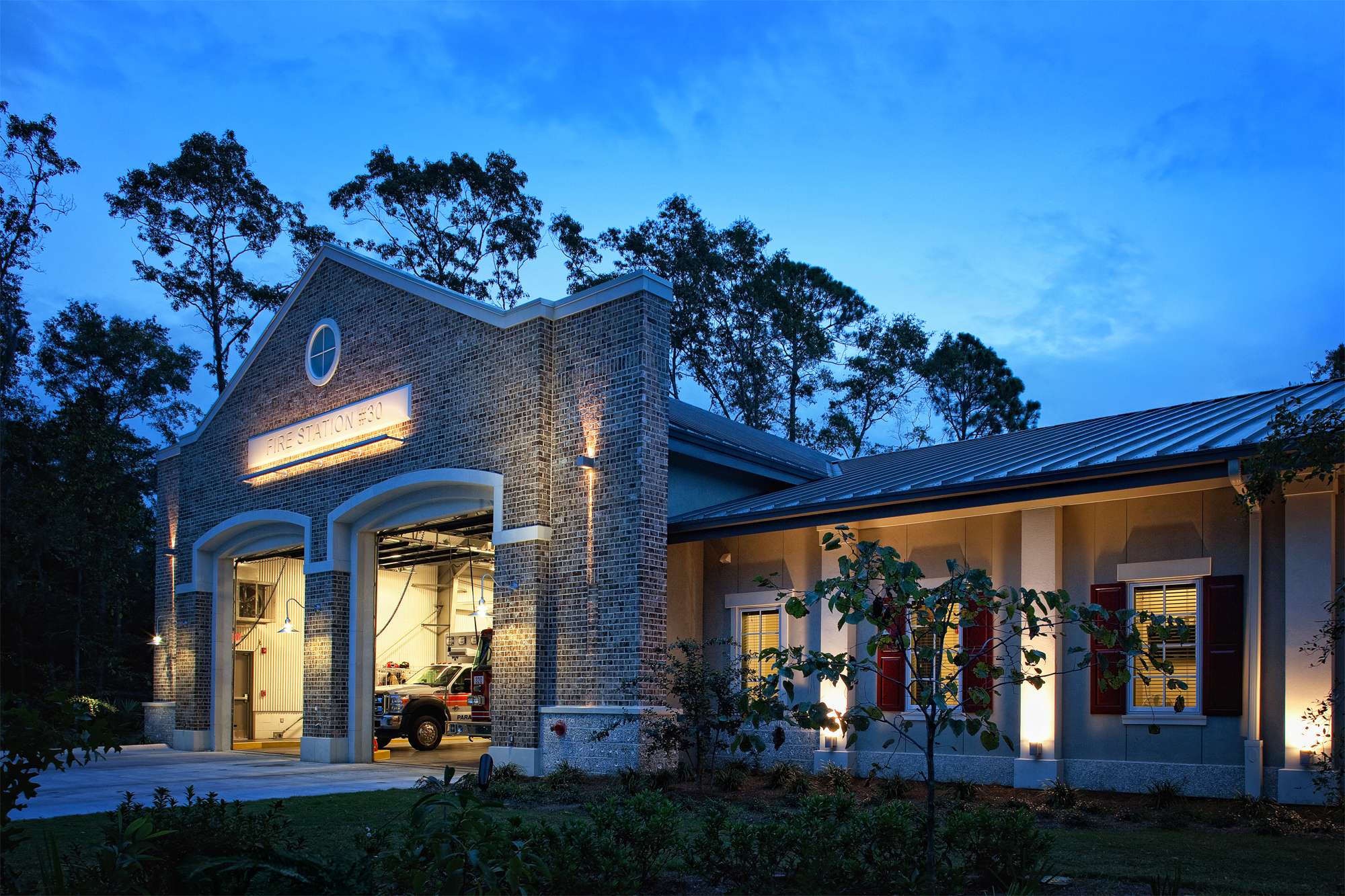 Bluffton Township Fire Station exterior view at dusk