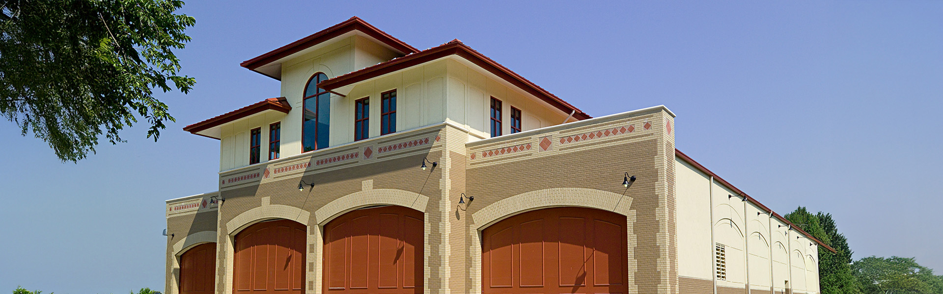 District of Columbia Fire Department multi-story building with arched entry bays and stucco facade