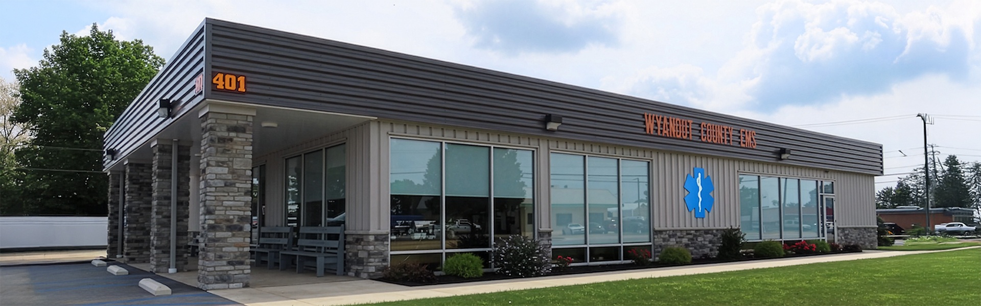 Wyandot County EMS care clinic exterior with ribbed metal panels and stone veneer columns