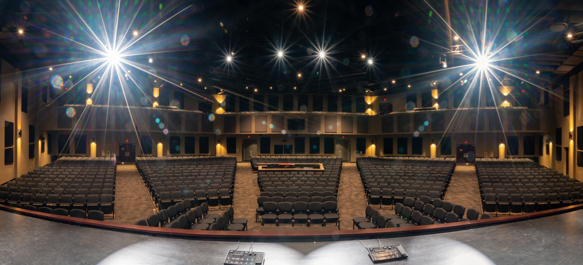 View from stage with exposed ceiling beams and ductwork