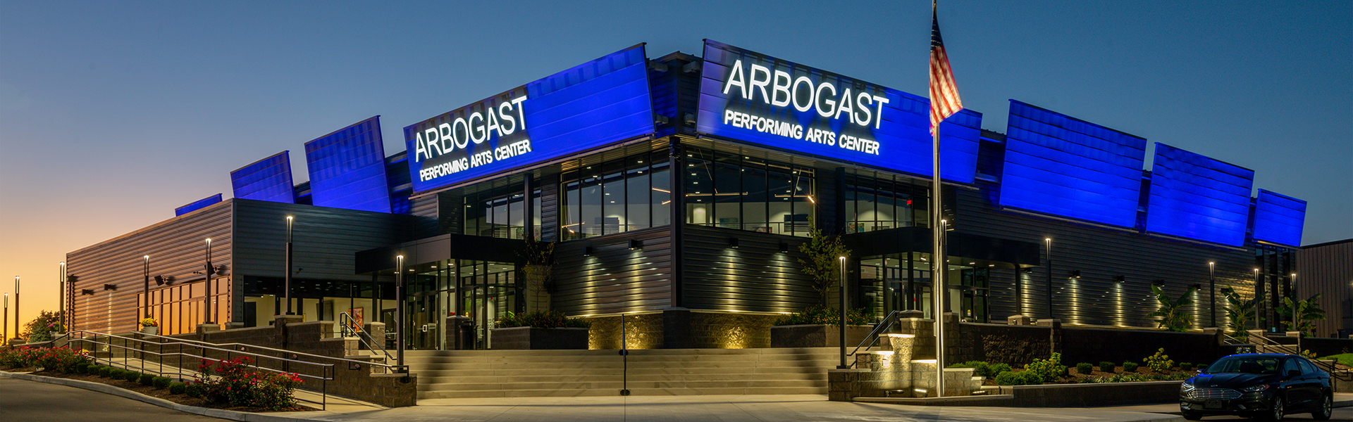Arbogast Performing Arts Center exterior entrance at dusk