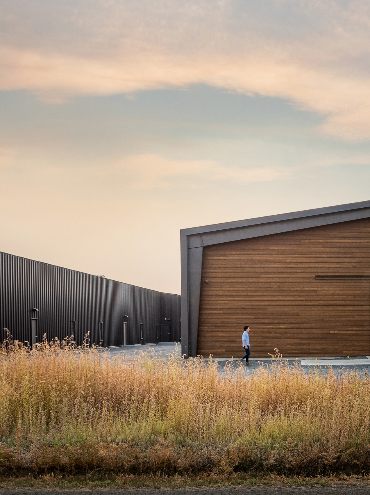 Woodinville Whiskey warehouse buildings with wood facade and metal siding