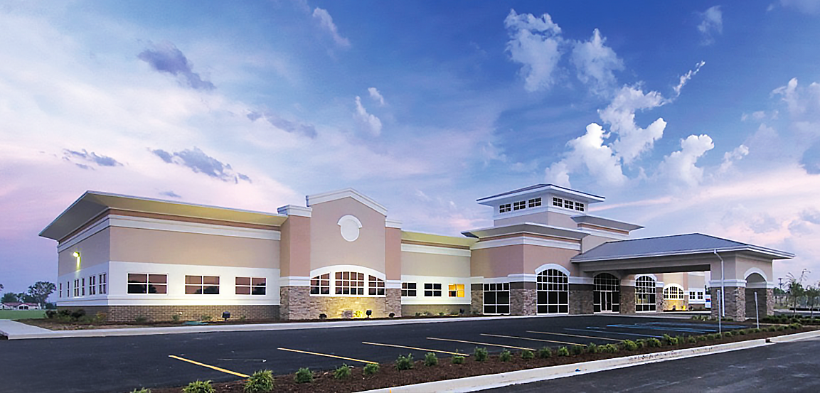 New healthcare building with steel system under bright blue sky