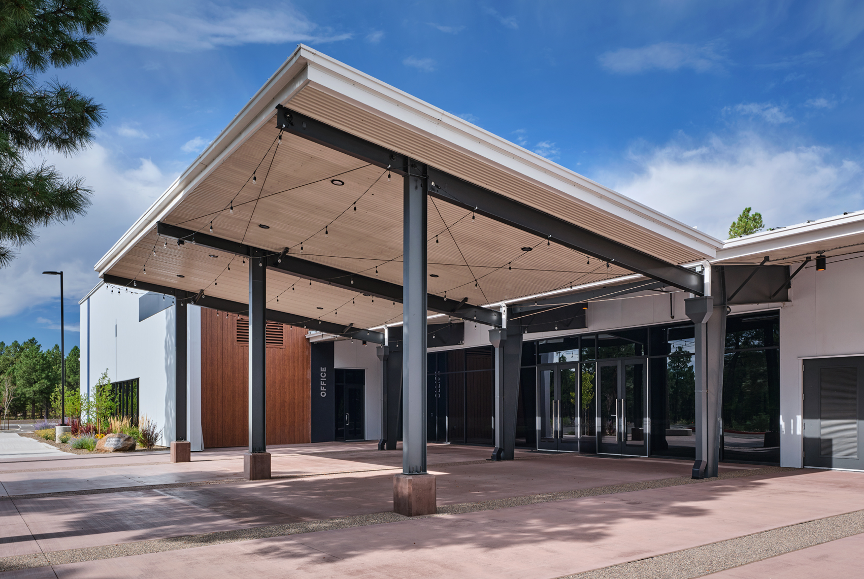 Grace Community Church covered entry canopy with exposed steel columns and metal roof panels
