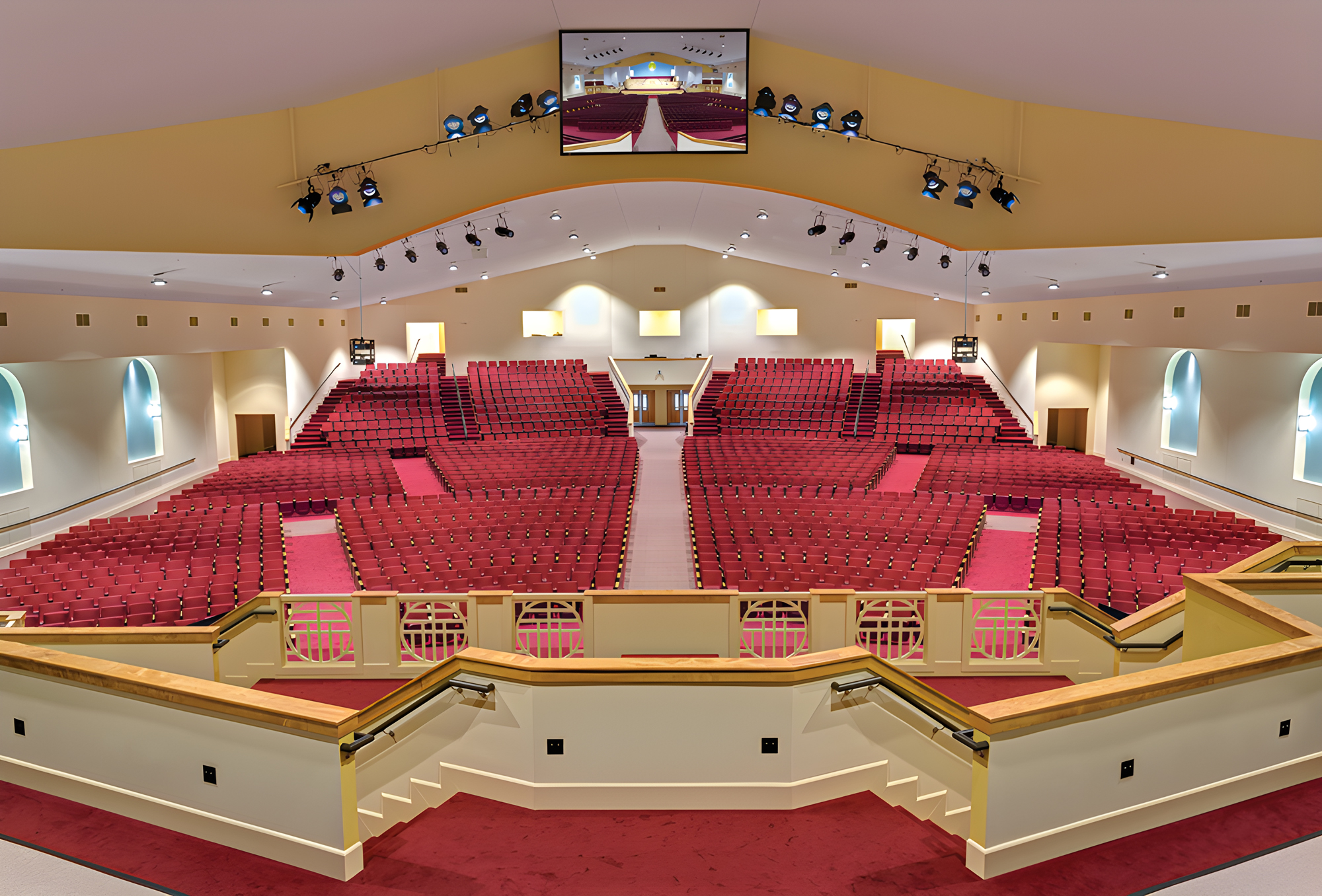 Mount Moriah Missionary Baptist Church auditorium with tiered red seating and a vaulted ceiling