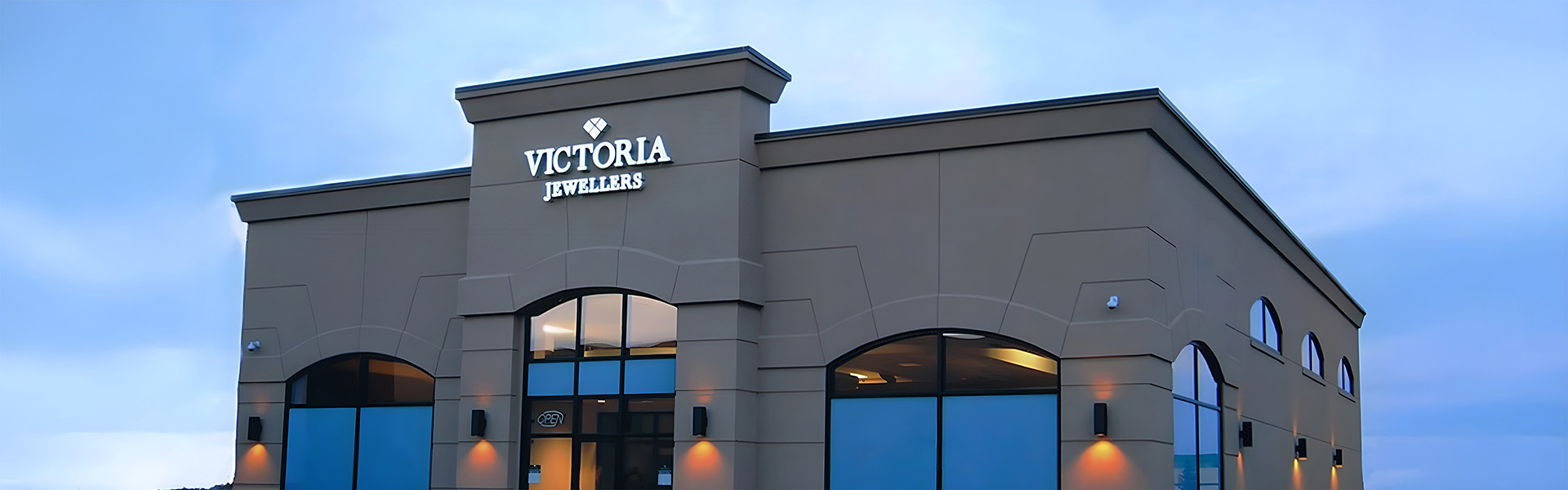 Victoria Jewellers building exterior with arched windows and stucco facade