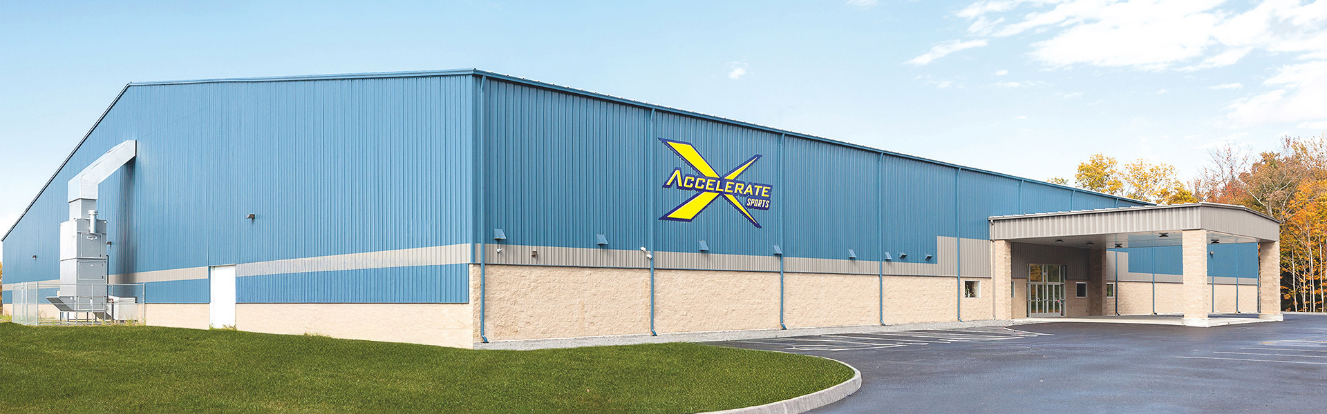 Accelerate Sports facility with vertical rib wall panels and masonry base wainscot