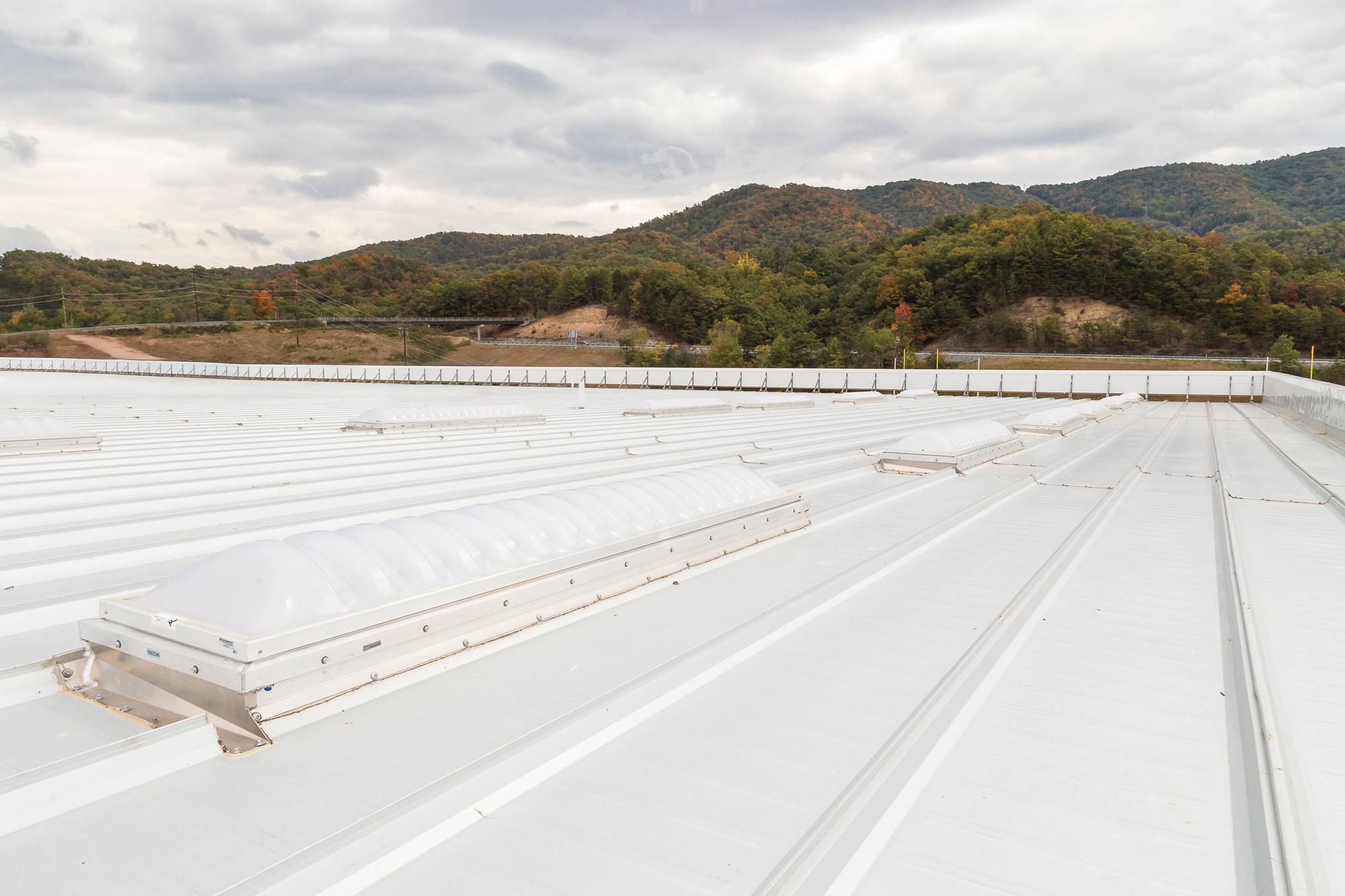 Advocare Sports Performance Center's white standing-seam metal roof with continuous skylight monitors