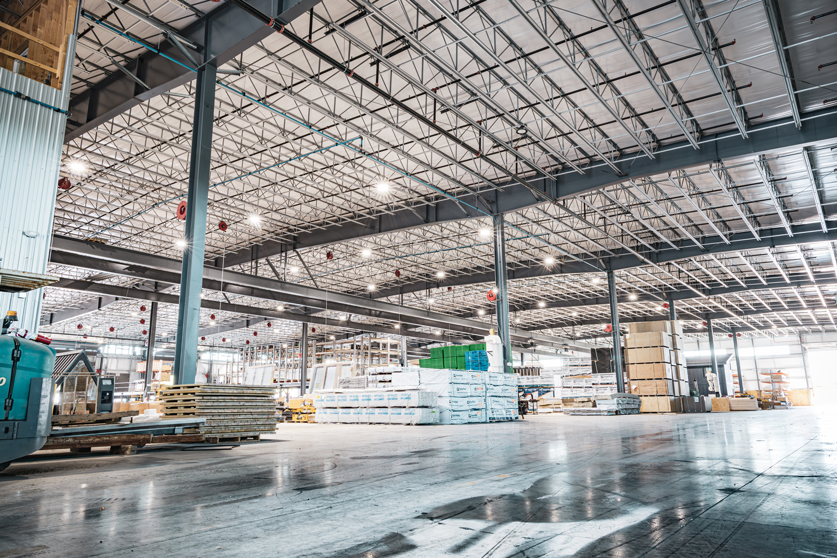Sheds Unlimited warehouse interior with exposed steel columns and roof trusses