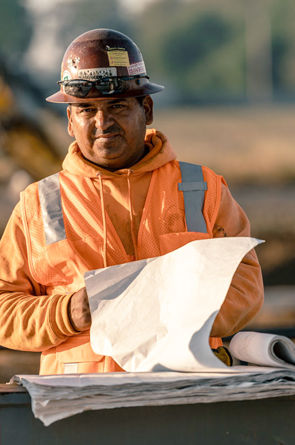 Butler Builder with building specs on job site