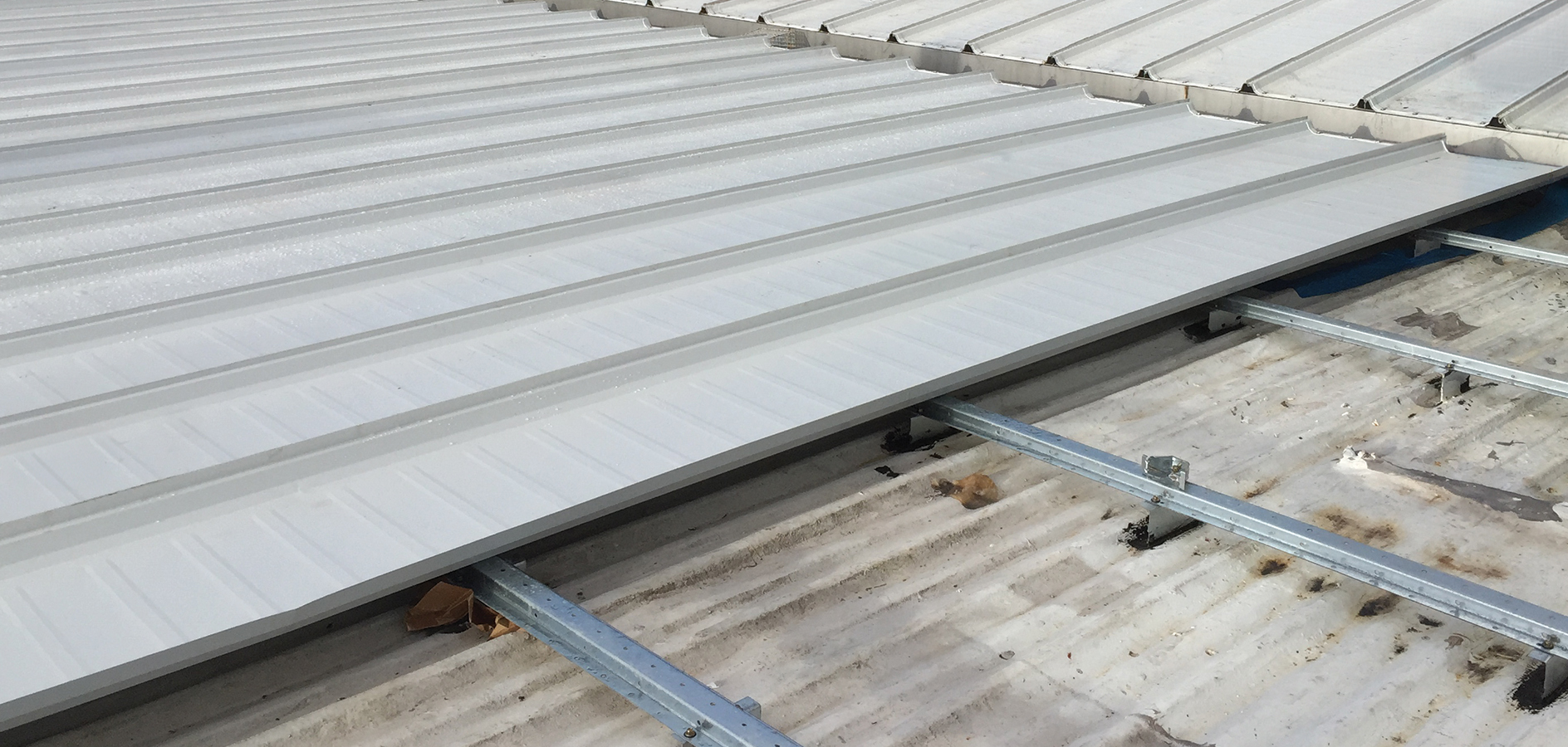 High-Profile Metal-Over-Metal reroof with standing seam roofing