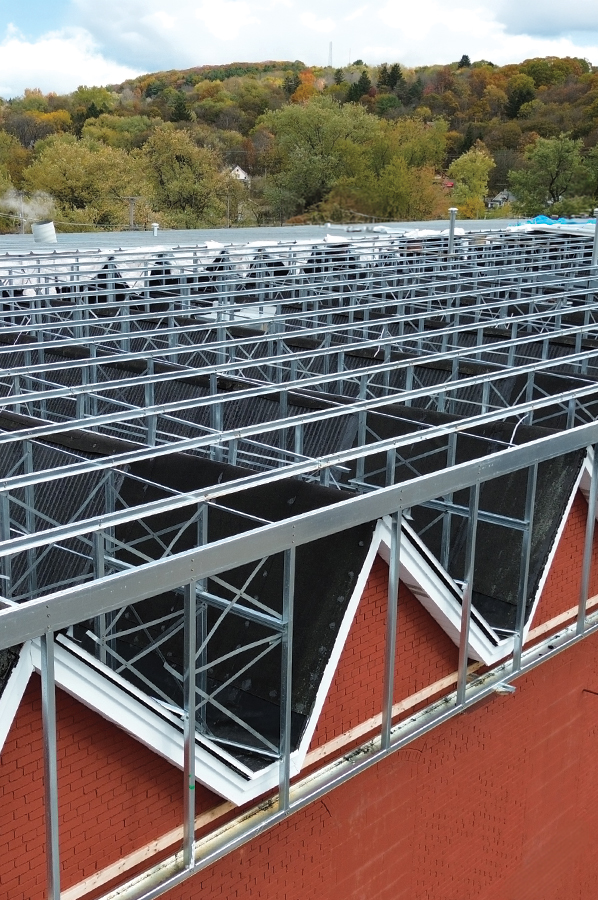 Slope Build-Up Reroof Framing System over peaked original roofing